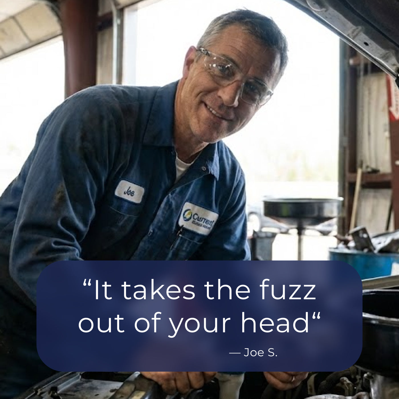 Mechanic in a workshop with a quote overlay. It takes the fuzz out of your head.