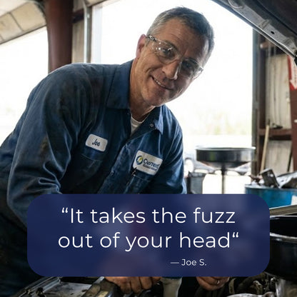 Mechanic in a workshop with a quote overlay. It takes the fuzz out of your head.